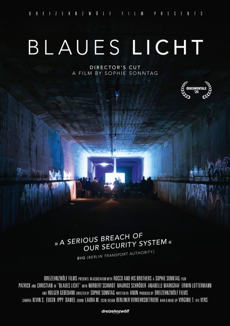 A dimly lit room with blue lighting and large silhouettes, featuring a film title and tagline.